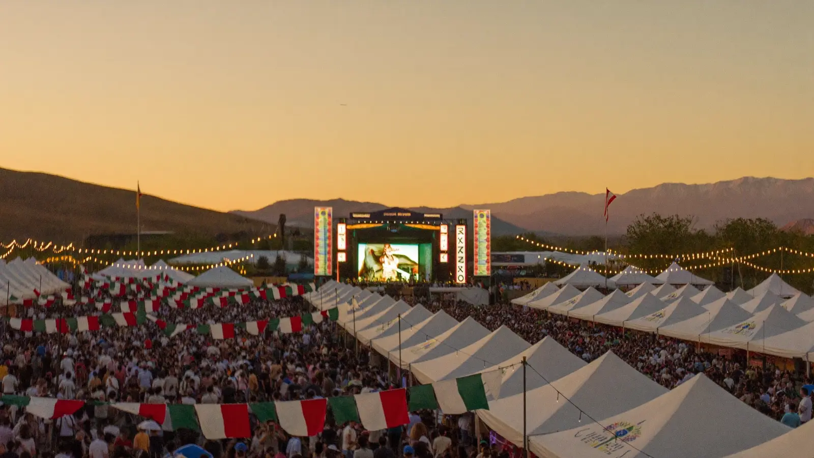A large crowd gathered at dusk across the festival grounds in Stockton